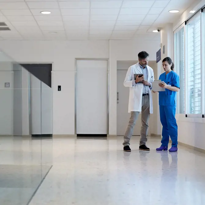 Medical hallway with two doctors in the back